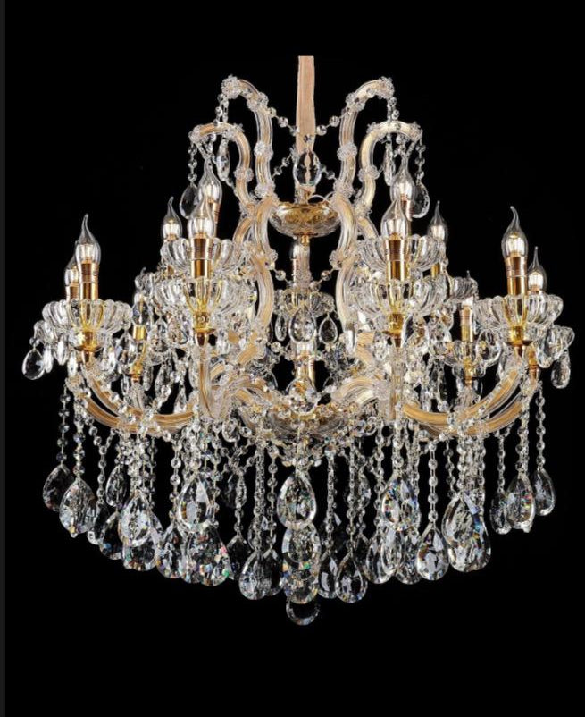 Crystal chandelier with gold accents on a black background