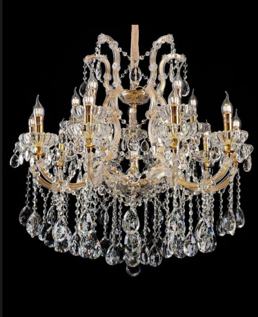 Crystal chandelier with gold accents on a black background